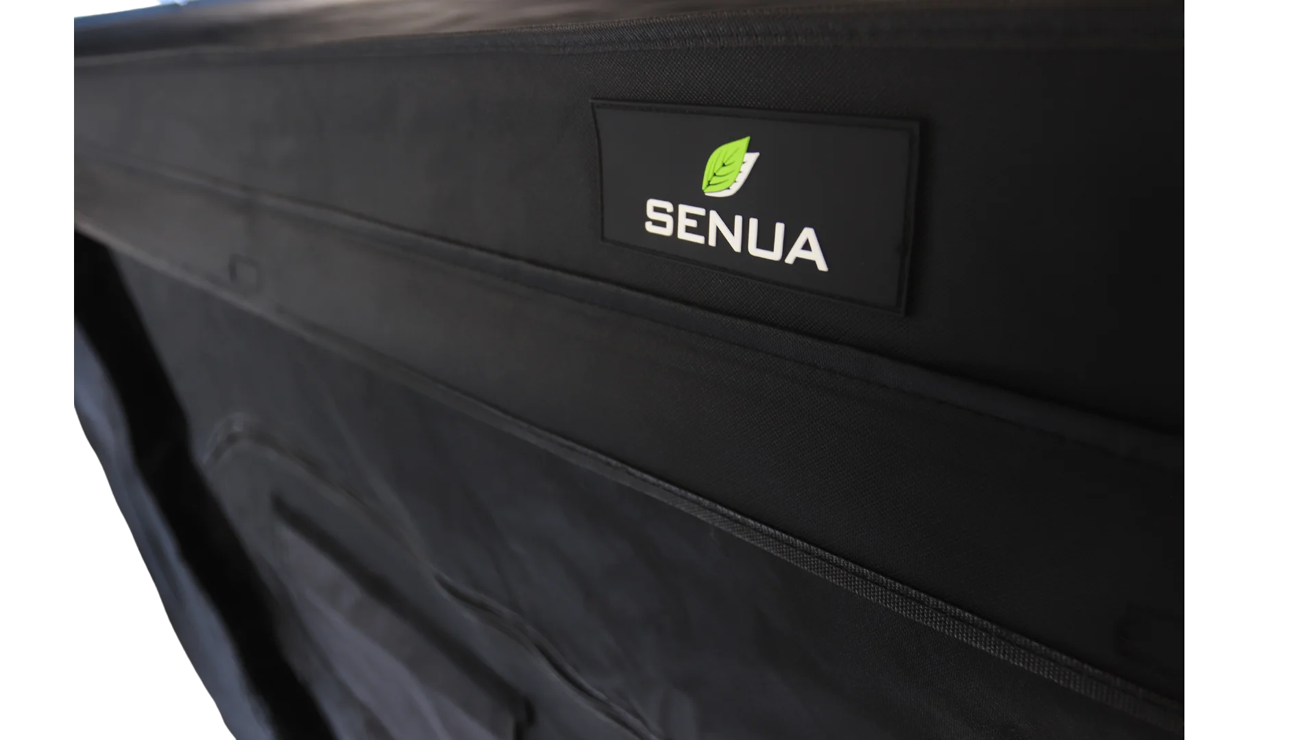 The leather stitched logo for Senua Hydroponics sewn into the top of the grow tent